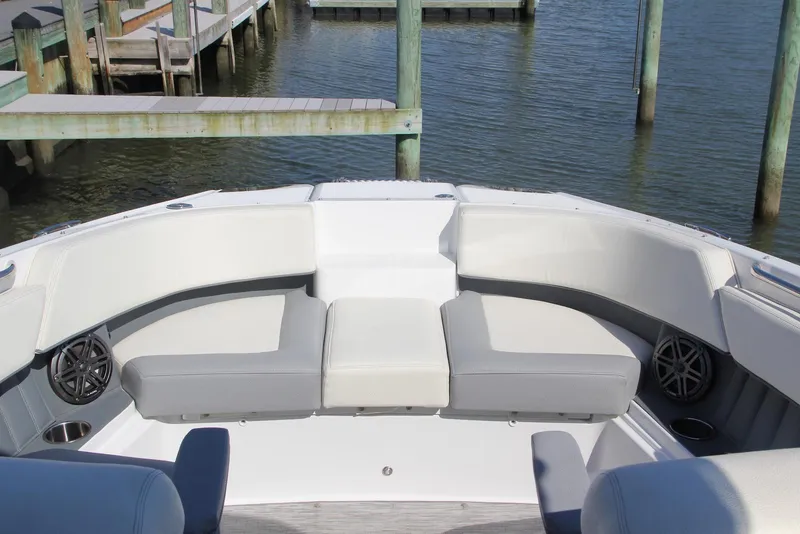 Slide: The Image of Bow seating area of a 2021 Cobalt 25SC boat at a dock. - 7