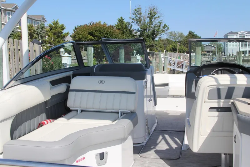 Slide: The Image of 2021 Cobalt 25SC boat interior with luxurious seating and modern design. - 6
