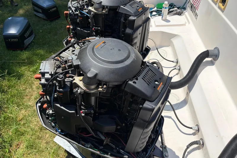 Slide: The Image of Twin Yamaha outboard engines on a 1999 Grady-White Marlin 300 boat, partially disassembled. - 15