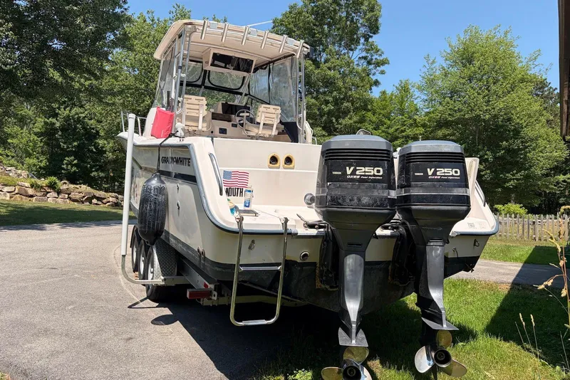 Slide: The Image of 1999 Grady-White Marlin 300 boat with twin Yamaha V250 engines, parked outdoors. - 14