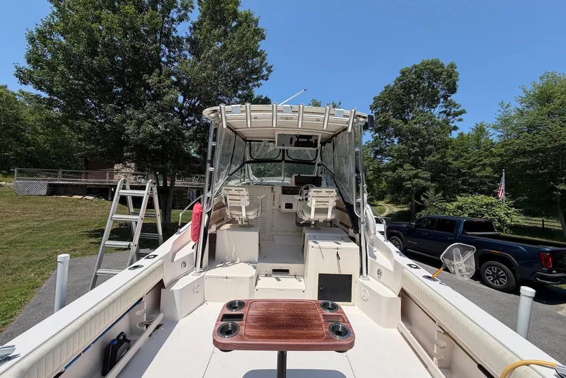Slide: The Image of 1999 Grady-White Marlin 300 boat with seating, table, and outdoor setting. - 3