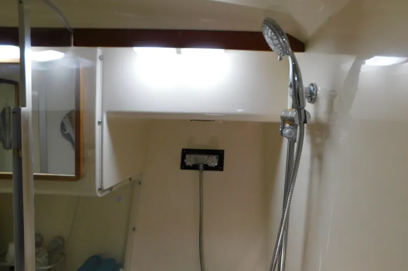 Slide: The Image of Shower area inside 1990 Sea Ray 350 Express Cruiser boat cabin. - 40