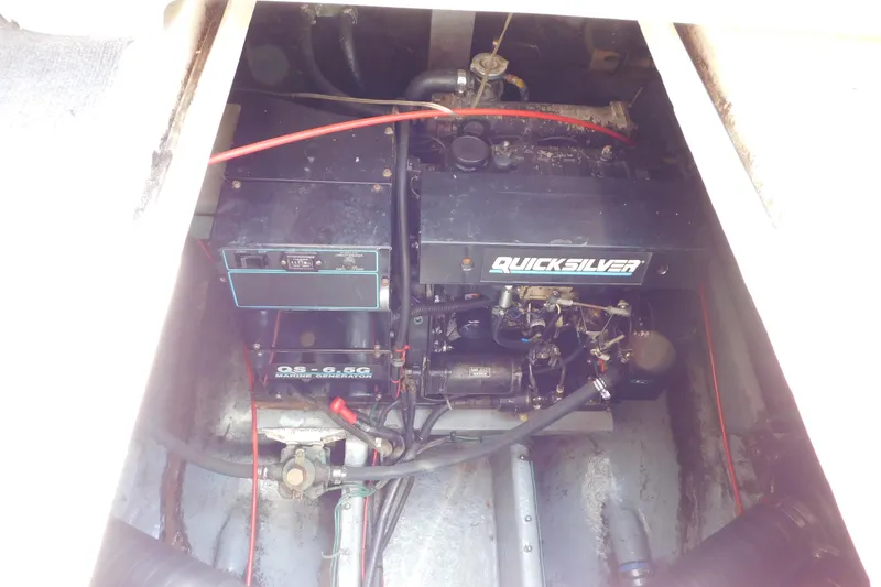 Slide: The Image of Engine compartment of a 1990 Sea Ray 350 Express Cruiser with Quicksilver marine generator. - 74