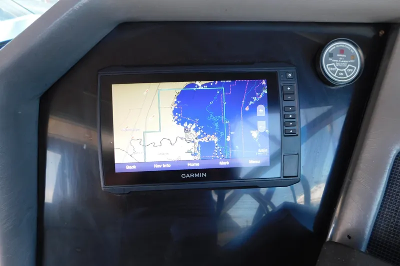 Slide: The Image of Garmin navigation system on 1990 Sea Ray 350 Express Cruiser dashboard. - 18