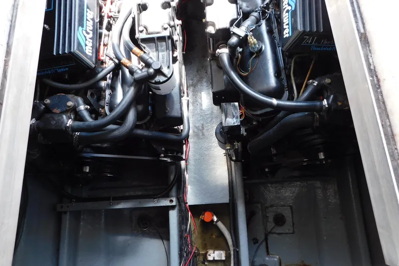 Slide: The Image of Engine compartment of a 1990 Sea Ray 350 Express Cruiser with MerCruiser engines. - 64