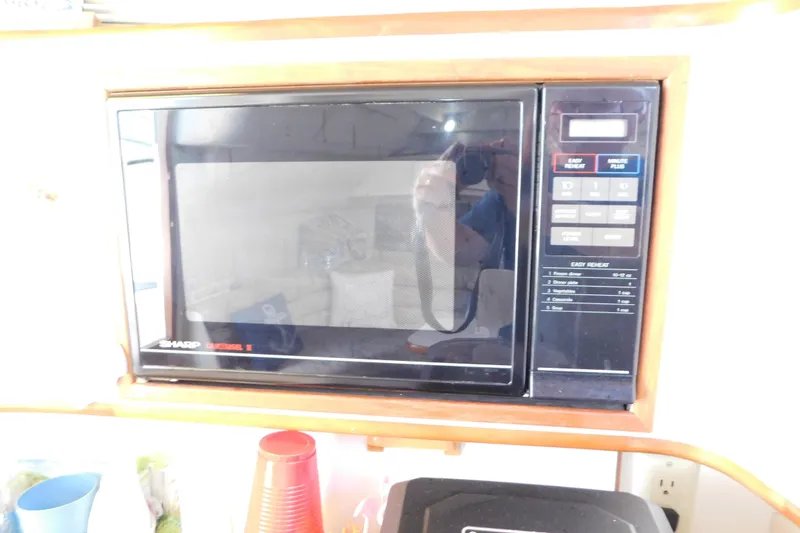 Slide: The Image of Sharp Carousel II microwave in 1990 Sea Ray 350 Express Cruiser kitchen. - 53