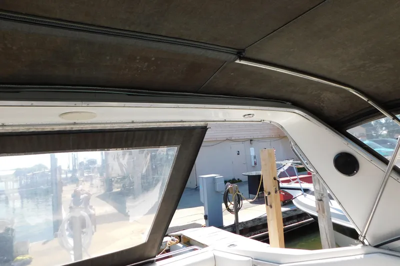 Slide: The Image of Interior view of 1990 Sea Ray 350 Express Cruiser at dockside. - 21