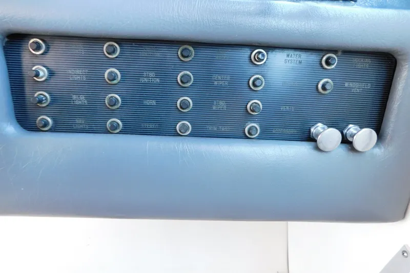 Slide: The Image of Control panel of a 1990 Sea Ray 350 Express Cruiser boat. - 16