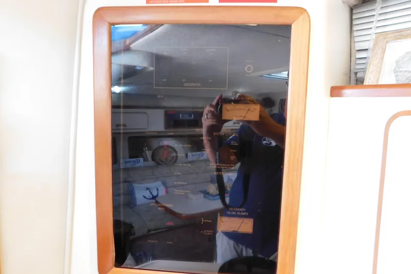 Slide: The Image of Control panel inside a 1990 Sea Ray 350 Express Cruiser boat cabin. - 59