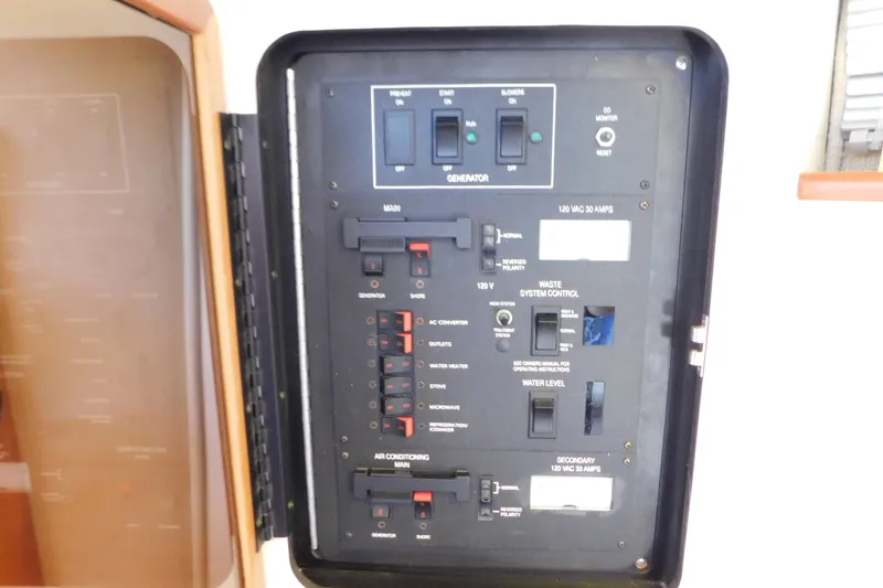 Slide: The Image of Electrical control panel on a 1990 Sea Ray 350 Express Cruiser boat. - 60