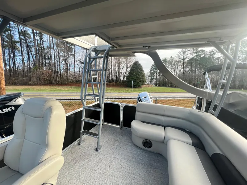 Slide: The Image of Interior of a Premier 240 SunSpree Water Slide pontoon boat with gray seating and a slide. - 12
