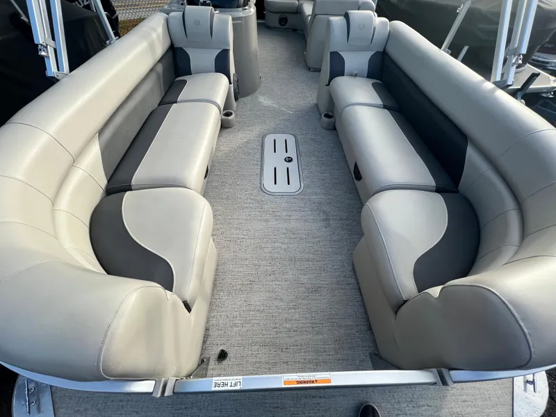 Slide: The Image of Interior view of a Premier 240 SunSpree Water Slide pontoon boat with gray upholstered seating. - 4