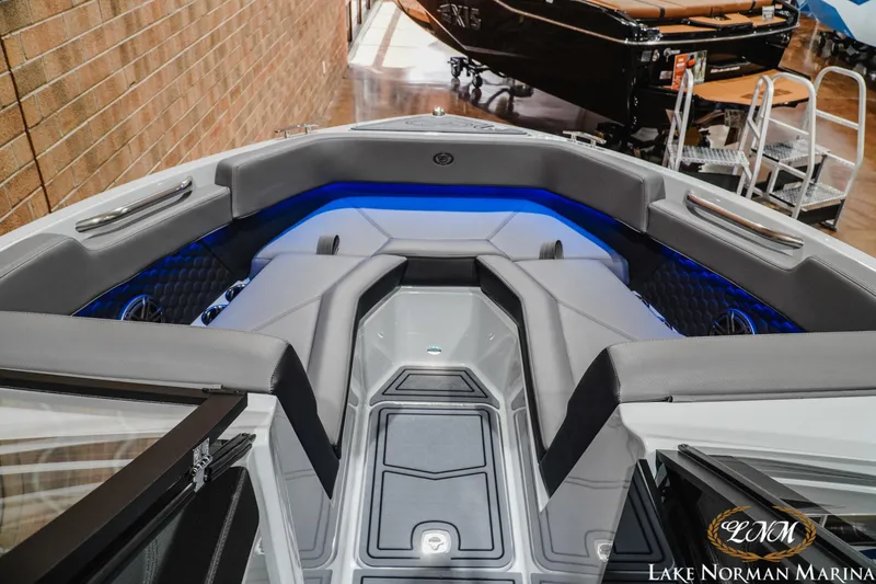 Slide: The Image of 2026 Cobalt R4 Surf boat interior with sleek seating and ambient blue lighting. - 17