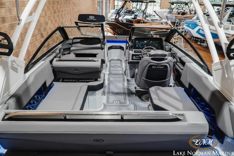 Slide: The Image of 2026 Cobalt R4 Surf boat interior with modern dashboard and seating at Lake Norman Marina. - 9