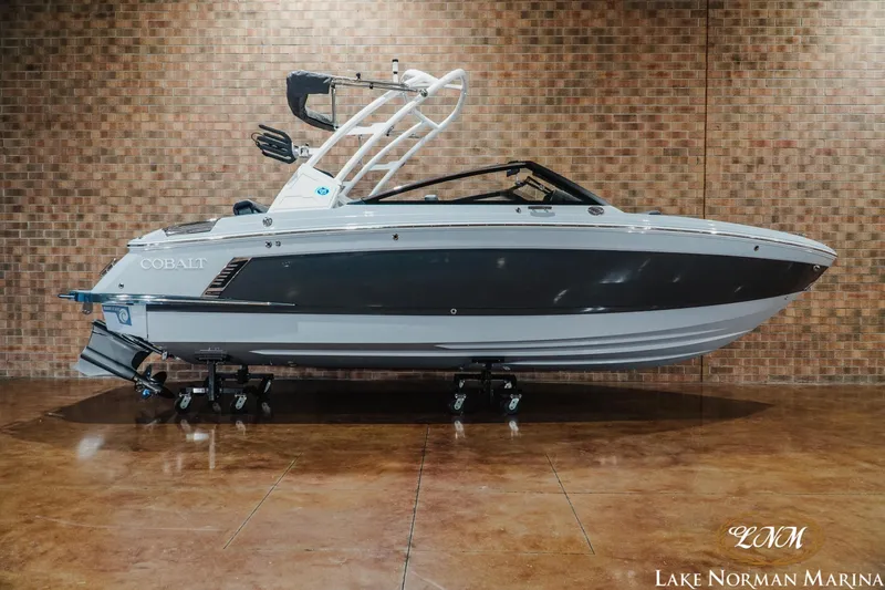 The Image of 2026 Cobalt R4 Surf boat displayed indoors at Lake Norman Marina. - 1