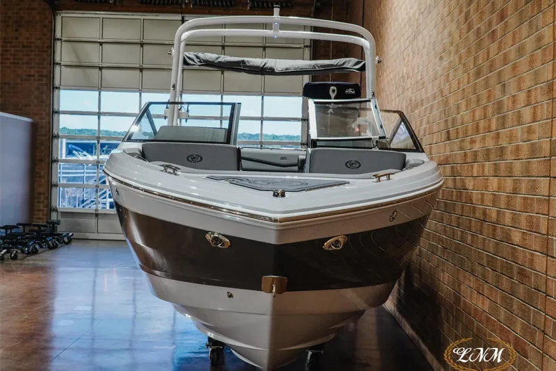 Slide: The Image of 2026 Cobalt R4 Surf boat in showroom, showcasing sleek design and modern features. - 4