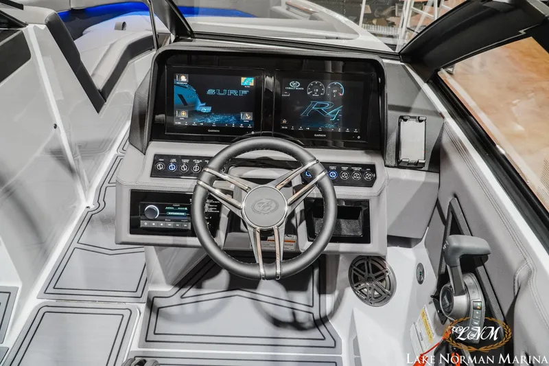 Slide: The Image of 2026 Cobalt R4 Surf boat dashboard with advanced controls and touchscreen display. - 14