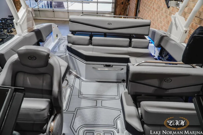 Slide: The Image of 2026 Cobalt R4 Surf boat interior with luxurious gray seating and modern design at Lake Norman Marina. - 19