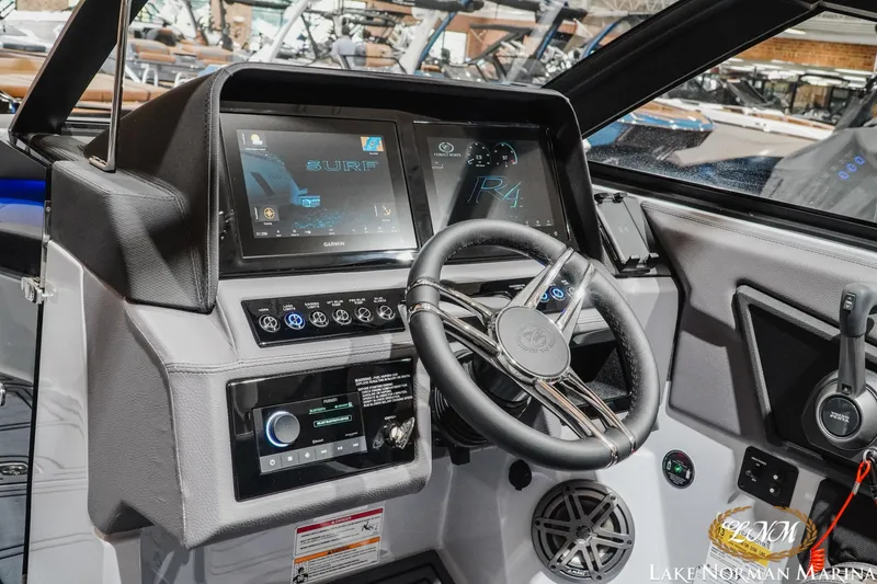 Slide: The Image of 2026 Cobalt R4 Surf boat dashboard with advanced controls and touchscreen display. - 16