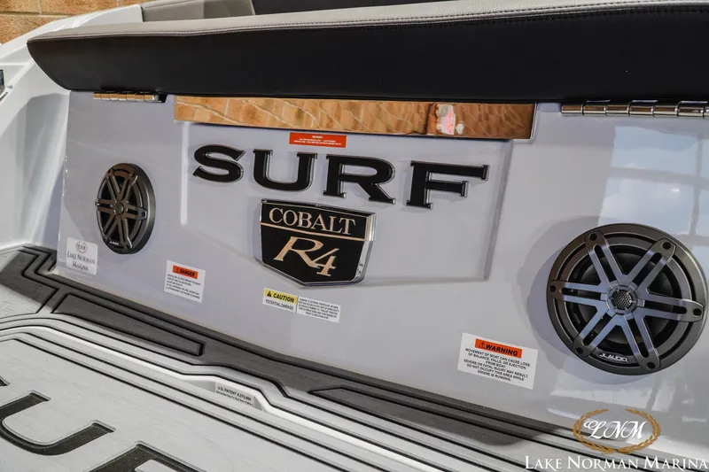 Slide: The Image of 2026 Cobalt R4 Surf boat rear view with speakers and branding. - 25