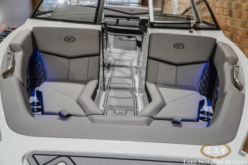 Slide: The Image of 2026 Cobalt R4 Surf boat interior with gray seating and blue accent lighting. - 7