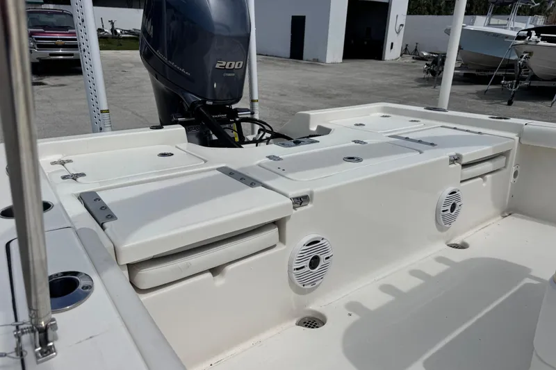 Slide: The Image of 2023 Key West 230 Bay Reef boat with Yamaha 200 engine, featuring spacious deck and storage. - 11