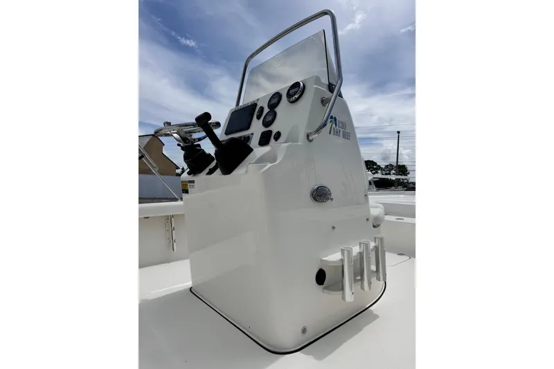 Slide: The Image of 2023 Key West 230 Bay Reef boat console with steering wheel and controls. - 9