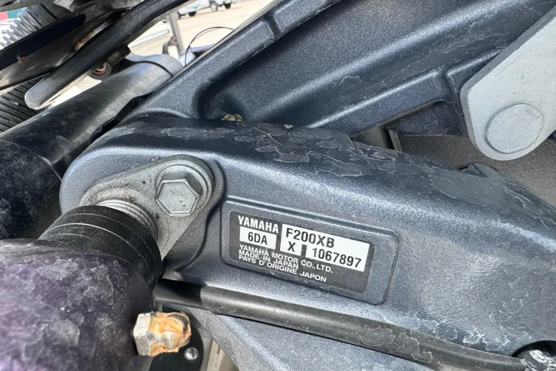 Slide: The Image of Close-up of a Yamaha F200XB engine part on a 2023 Key West 230 Bay Reef boat. - 14