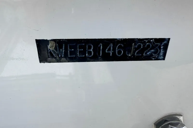 Slide: The Image of 2023 Key West 230 Bay Reef boat identification number on hull. - 13