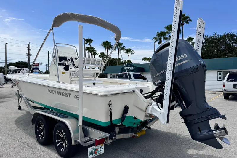 Slide: The Image of 2023 Key West 230 Bay Reef boat with Yamaha outboard motor on a trailer. - 2