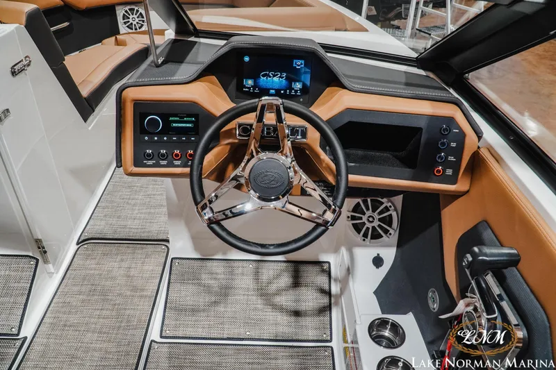 Slide: The Image of 2026 Cobalt CS23 boat dashboard with modern controls and sleek steering wheel design. - 11
