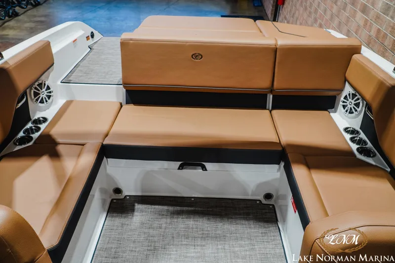 Slide: The Image of Luxurious seating area of 2026 Cobalt CS23 boat with tan upholstery. - 18