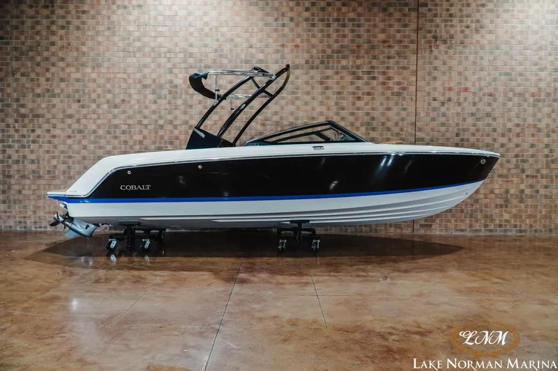 The Image of 2026 Cobalt CS23 boat displayed indoors at Lake Norman Marina. - 1