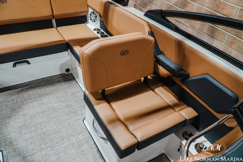 Slide: The Image of 2026 Cobalt CS23 boat interior with tan leather seating and modern design. - 17