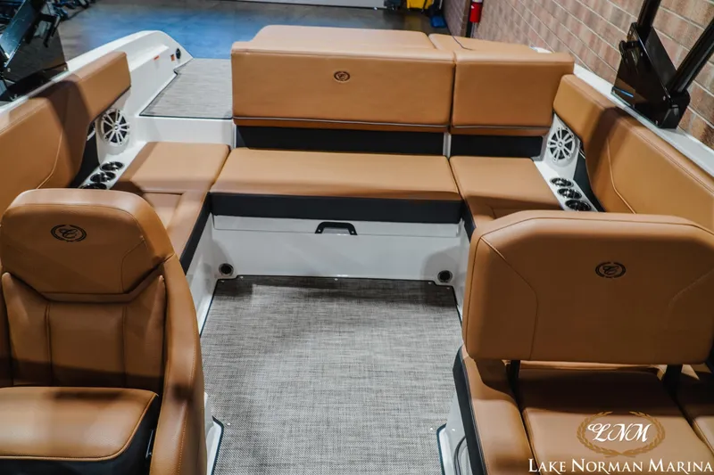 Slide: The Image of 2026 Cobalt CS23 boat interior with tan leather seating and modern design. - 16