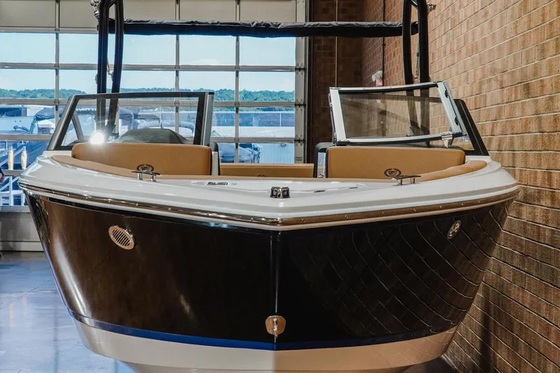 Slide: The Image of 2026 Cobalt CS23 boat in showroom, featuring sleek design and modern amenities. - 4