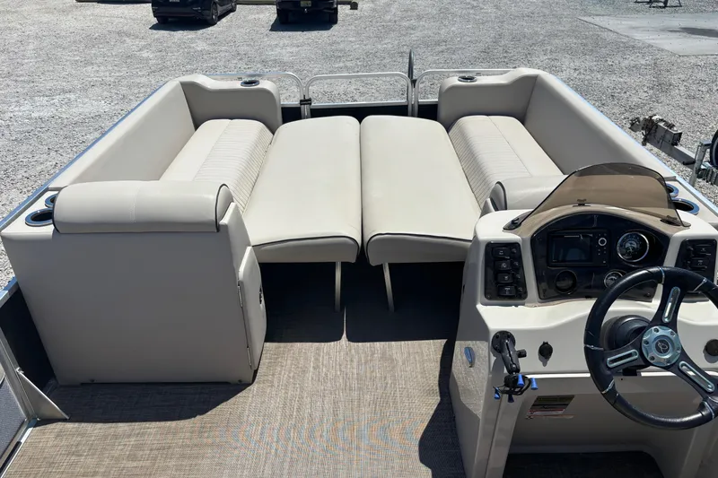 Slide: The Image of 2017 Qwest LS 822 Bar pontoon boat interior with beige seating and steering console. - 9