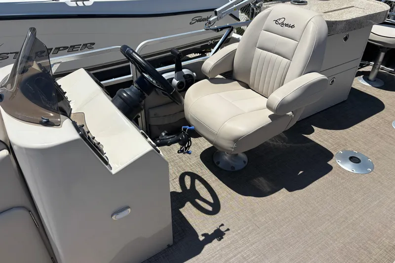 Slide: The Image of 2017 Qwest LS 822 Bar boat interior with beige captain's chair and steering console. - 11