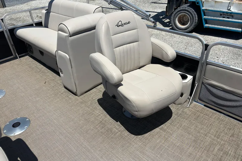 Slide: The Image of 2017 Qwest LS 822 Bar boat interior with beige seating and carpeted floor. - 17