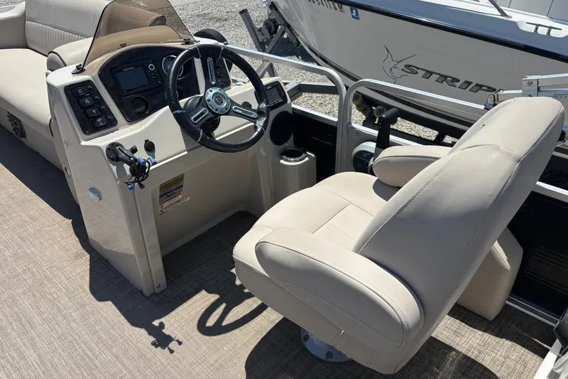 Slide: The Image of 2017 Qwest LS 822 Bar boat interior with steering console and comfortable seating. - 12