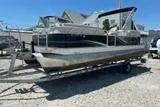 The Image of 2017 Qwest LS 822 Bar pontoon boat on trailer in outdoor setting. - 0