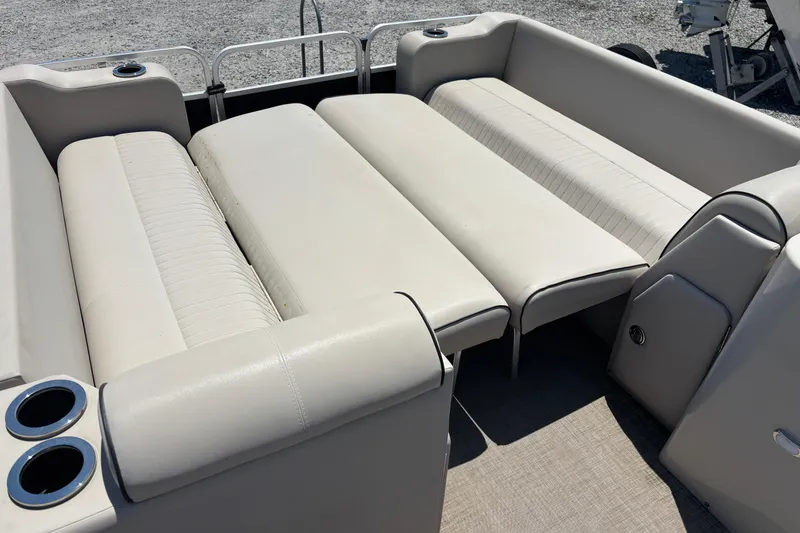 Slide: The Image of 2017 Qwest LS 822 Bar boat interior with beige seating and cup holders. - 10