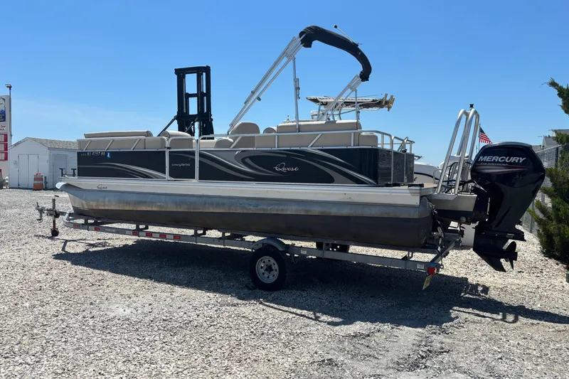 Slide: The Image of 2017 Qwest LS 822 Bar pontoon boat on trailer with Mercury outboard motor. - 1