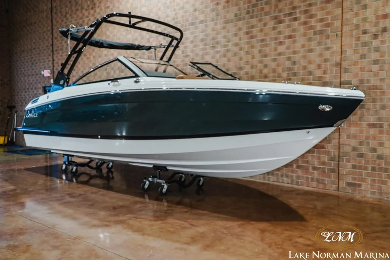 Slide: The Image of 2026 Cobalt R4 boat displayed indoors at Lake Norman Marina. - 3