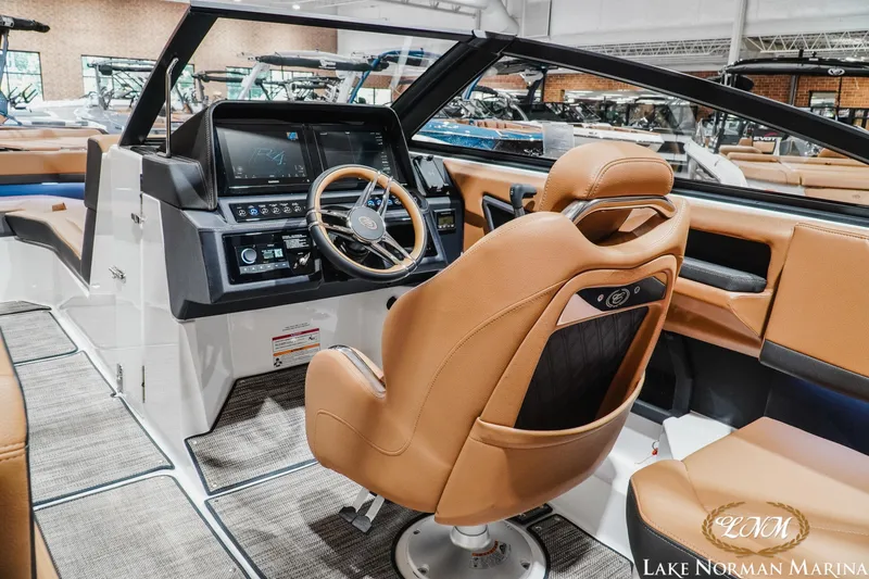 Slide: The Image of Luxurious interior of 2026 Cobalt R4 boat with modern dashboard and leather seating. - 15