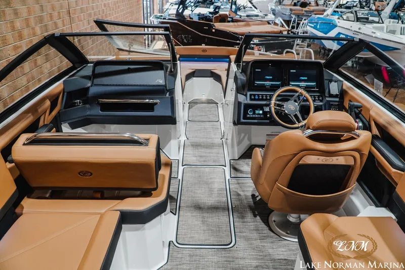 Slide: The Image of 2026 Cobalt R4 boat interior with luxurious seating and advanced dashboard at Lake Norman Marina. - 13