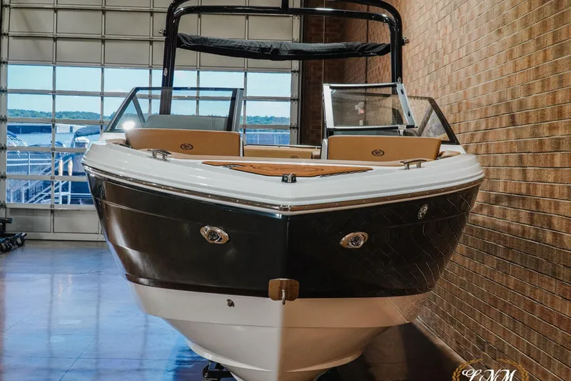 Slide: The Image of 2026 Cobalt R4 boat in showroom, featuring sleek design and modern amenities. - 4