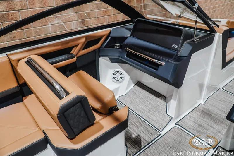 Slide: The Image of Luxurious interior of 2026 Cobalt R4 boat with tan and black seating, modern design. - 17