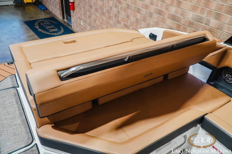 Slide: The Image of 2026 Cobalt R4 boat interior with tan leather seating at Lake Norman Marina. - 23