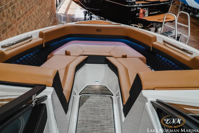 Slide: The Image of 2026 Cobalt R4 boat interior with tan seating and modern design at Lake Norman Marina. - 18